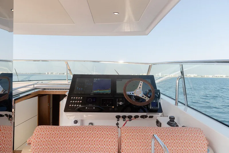  Yacht Photos Pics 2024 Delta Powerboats 60 Open helm with modern controls, overlooking serene ocean view.