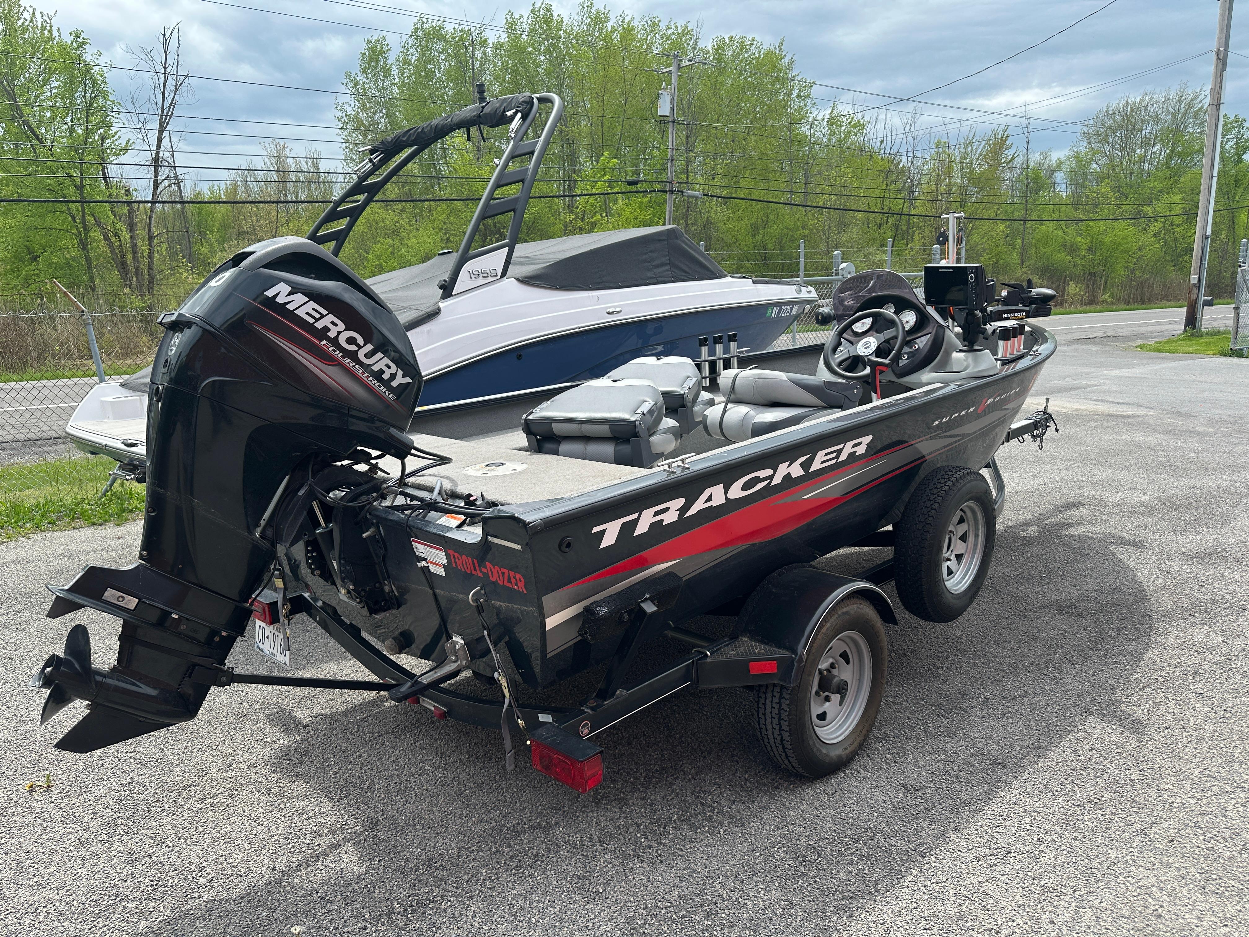 2013 Tracker Super Guide V-16 SC boat with Mercury engine on trailer.