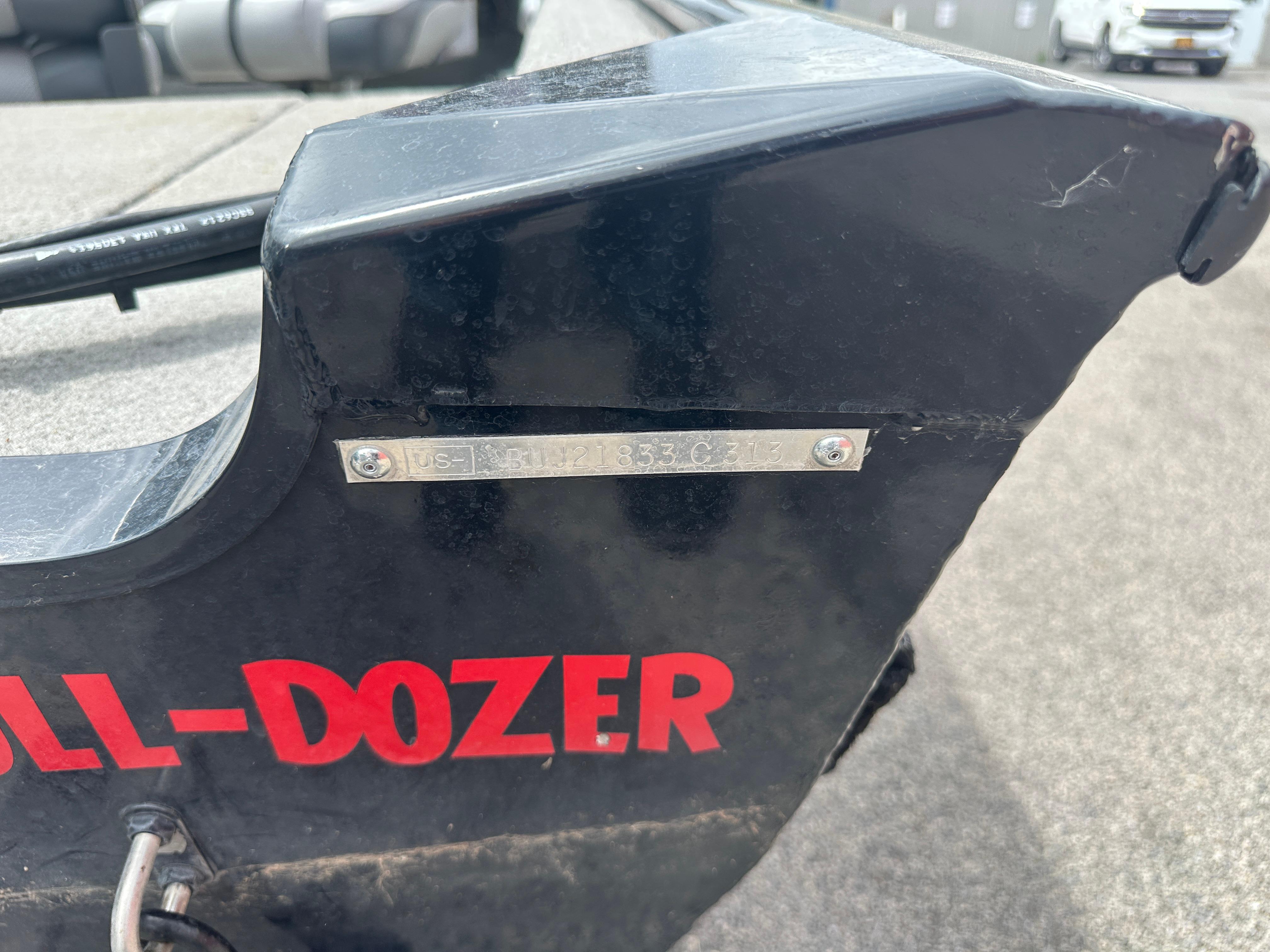 2013 Tracker Super Guide V-16 SC boat with visible identification plate and "BULL-DOZER" text.