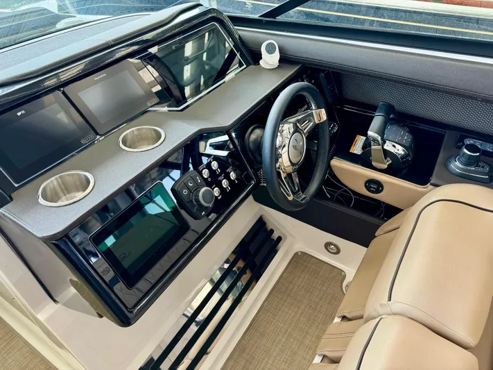  Yacht Photos Pics 2018 Sea Ray SLX 310 boat cockpit with modern controls and steering wheel.