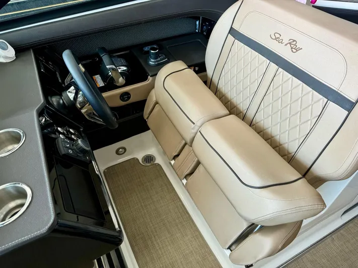  Yacht Photos Pics 2018 Sea Ray SLX 310 helm with beige captain's seat and steering wheel.