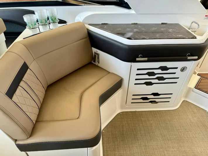  Yacht Photos Pics 2018 Sea Ray SLX 310 interior seating and storage area.