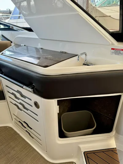  Yacht Photos Pics 2018 Sea Ray SLX 310 boat interior with sink and storage compartments.