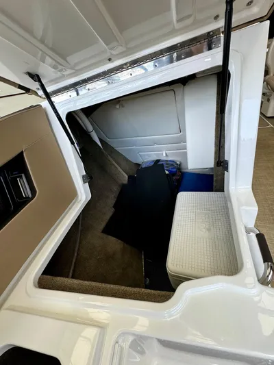  Yacht Photos Pics 2018 Sea Ray SLX 310 storage compartment with open hatch.