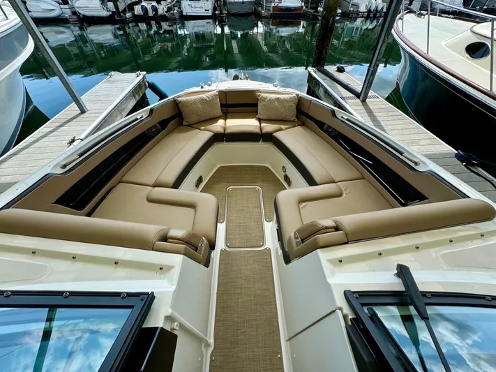  Yacht Photos Pics 2018 Sea Ray SLX 310 boat with spacious bow seating at the dock.