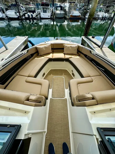  Yacht Photos Pics 2018 Sea Ray SLX 310 boat with spacious seating at a marina.