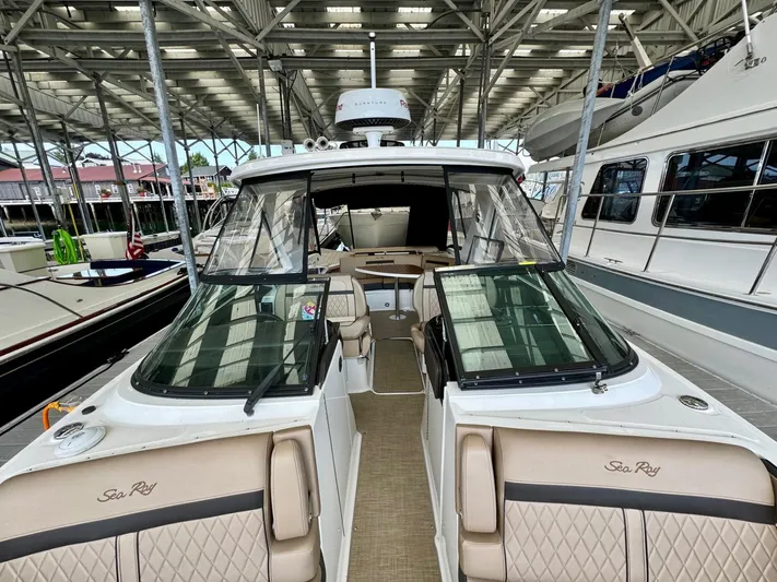  Yacht Photos Pics 2018 Sea Ray SLX 310 boat docked in a marina.