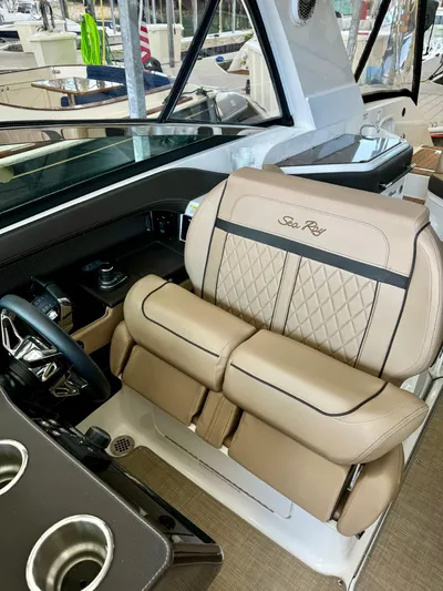  Yacht Photos Pics 2018 Sea Ray SLX 310 boat interior with luxurious beige seating.