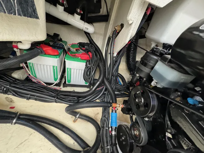  Yacht Photos Pics Engine compartment of a 2018 Sea Ray SLX 310 boat with batteries and wiring.