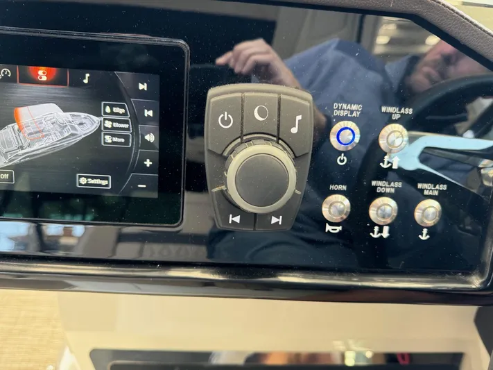  Yacht Photos Pics Control panel of a 2018 Sea Ray SLX 310 boat with touchscreen and buttons.