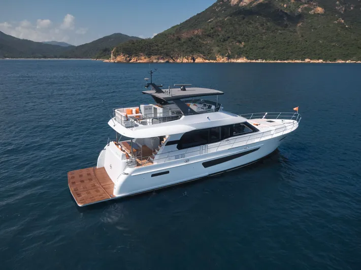  Yacht Photos Pics 2024 CL Yachts CLB65 luxury yacht cruising in scenic coastal waters.