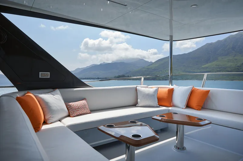  Yacht Photos Pics Luxurious 2024 CL Yachts CLB65 yacht deck with elegant seating and scenic ocean view.