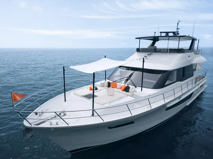  Yacht Photos Pics 2024 CL Yachts CLB65 luxury yacht cruising on open sea with modern design.