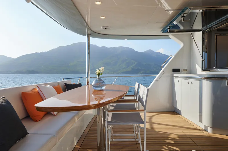  Yacht Photos Pics Luxurious 2024 CL Yachts CLB65 yacht interior with elegant seating and scenic ocean view.