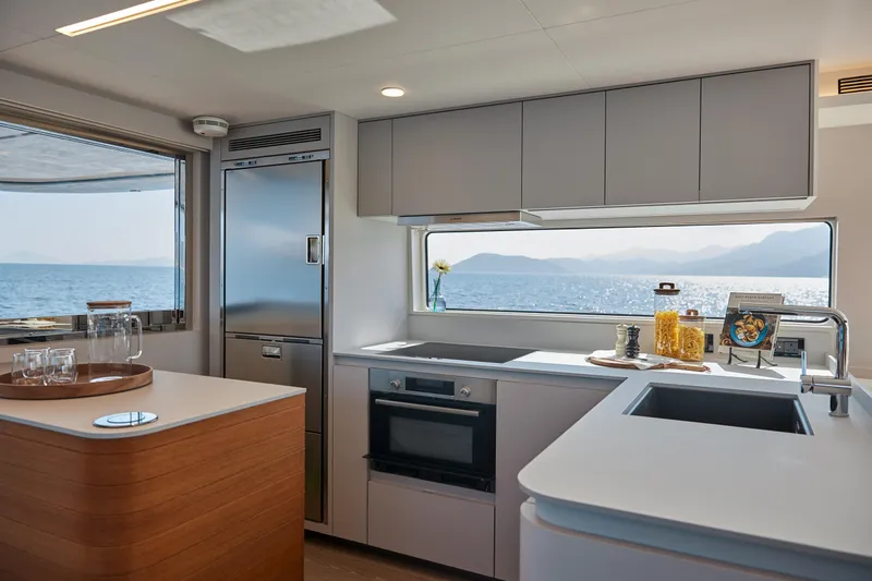  Yacht Photos Pics Modern kitchen interior of 2024 CL Yachts CLB65 with ocean view.