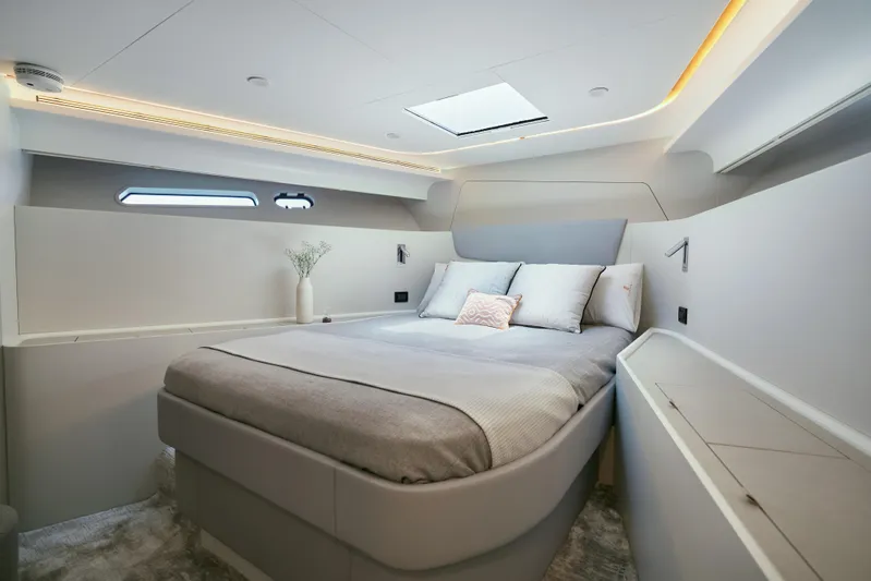  Yacht Photos Pics Luxurious bedroom interior of 2024 CL Yachts CLB65, featuring modern design and elegant lighting.