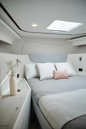  Yacht Photos Pics Luxurious 2024 CL Yachts CLB65 cabin interior with modern bedding and natural light.