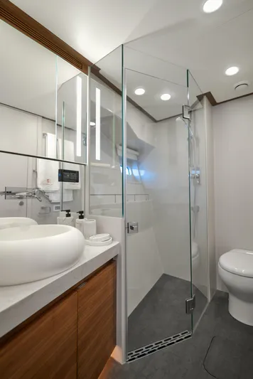  Yacht Photos Pics Modern bathroom in 2024 CL Yachts CLB65 with glass shower and sleek fixtures.