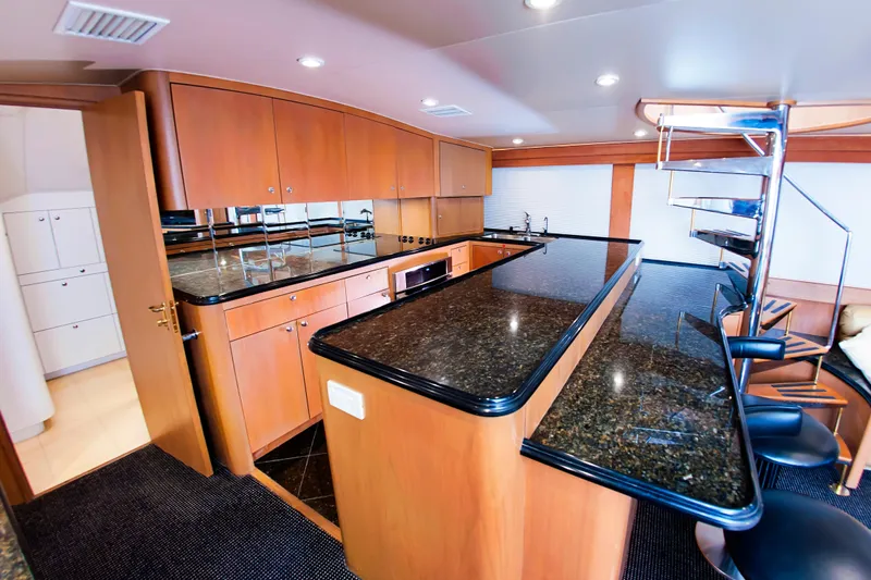  Yacht Photos Pics Luxurious kitchen interior of 2000 Buddy Davis 78 yacht with granite countertops.