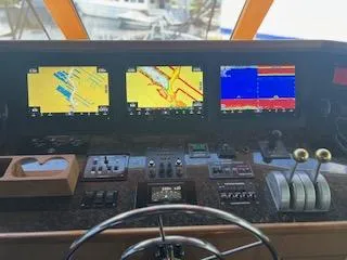  Yacht Photos Pics Control panel of a 2000 Buddy Davis 78 yacht with navigation screens.
