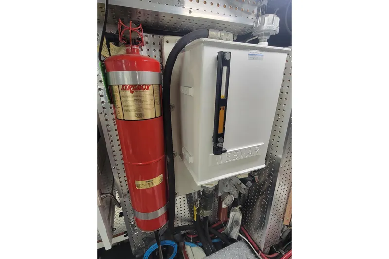 Fellowship Yacht Photos Pics Engine room of 2001 Grand Alaskan Pilothouse with Fireboy extinguisher and Wesmar equipment.