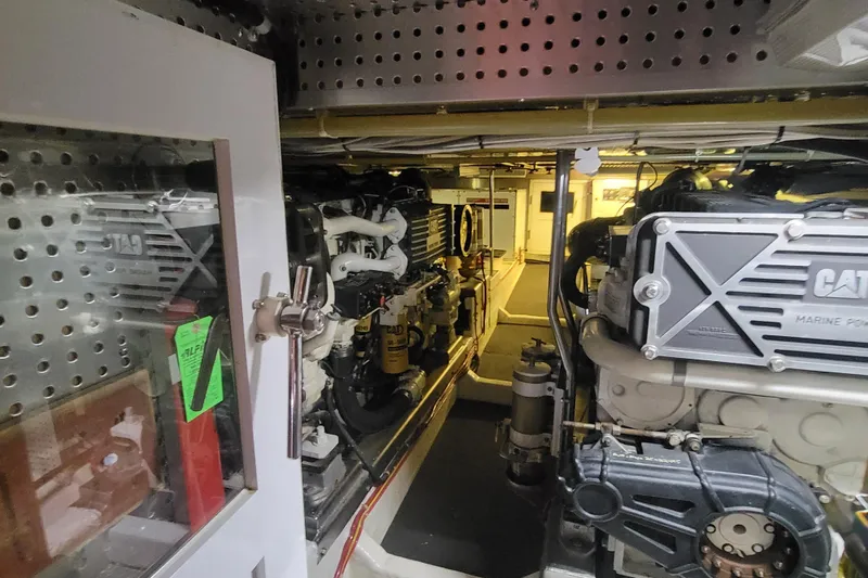 Fellowship Yacht Photos Pics Engine room of a 2001 Grand Alaskan Pilothouse yacht with CAT marine power engines.