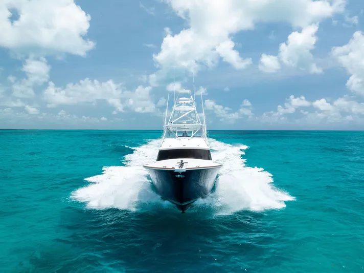 Diggin Donzi Yacht Photos Pics Donzi 73 Sportfish yacht cruising on turquoise waters under a clear sky, 2007 model.