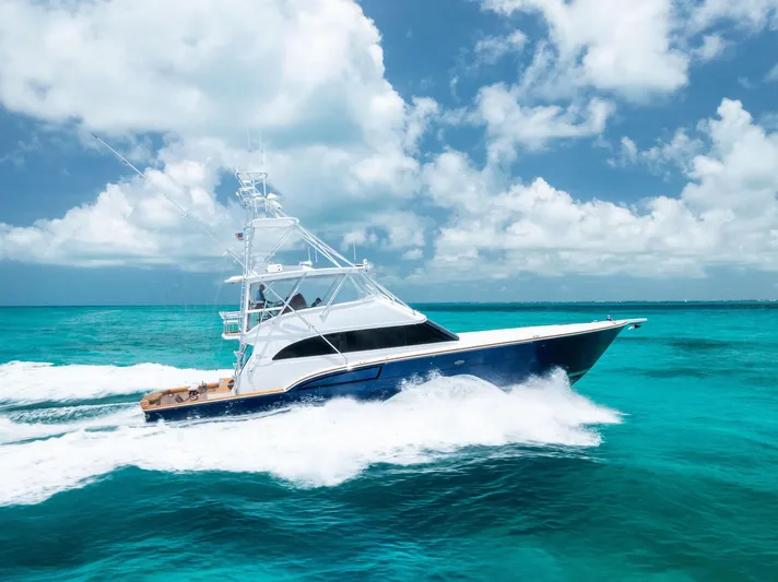 Diggin Donzi Yacht Photos Pics 2007 Donzi 73 Sportfish cruising on turquoise ocean under blue sky.