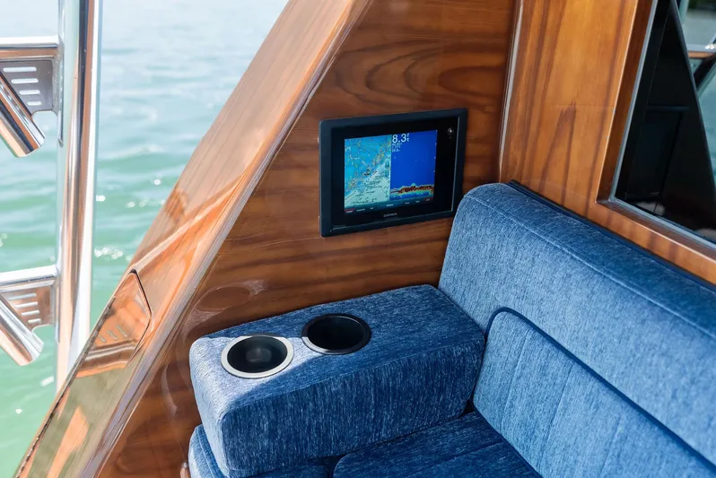 Diggin Donzi Yacht Photos Pics Interior of 2007 Donzi 73 Sportfish with blue seating and navigation display.