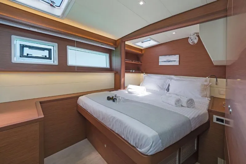 Lagoon 52f Yacht Photos Pics Luxurious cabin interior of 2019 Lagoon 52F yacht with modern design and cozy bedding.