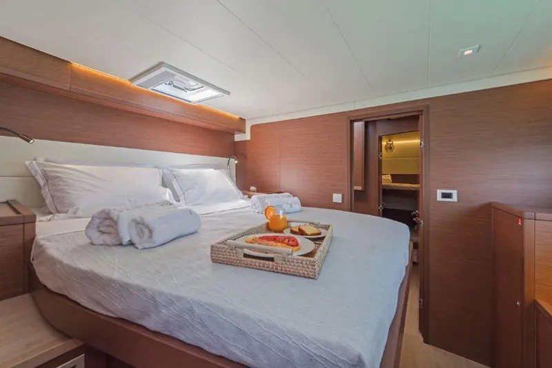 Lagoon 52f Yacht Photos Pics Luxurious cabin interior of 2019 Lagoon 52F yacht with breakfast tray on bed.
