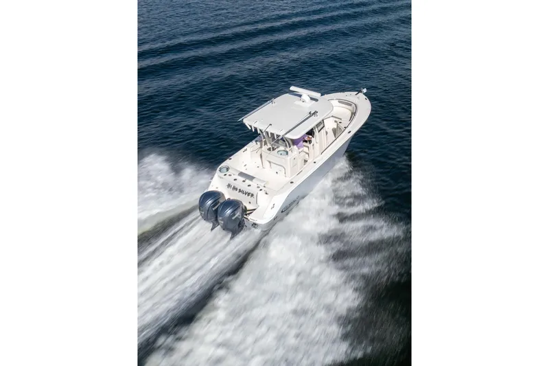 Hi Ho Silver Yacht Photos Pics 2022 Robalo R302 Center Console boat cruising on open water.