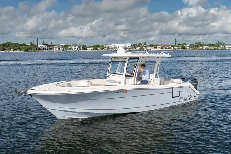 Hi Ho Silver Yacht Photos Pics 2022 Robalo R302 Center Console boat cruising on a sunny day.