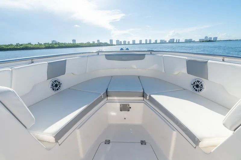 Hi Ho Silver Yacht Photos Pics 2022 Robalo R302 Center Console boat interior with spacious seating and scenic water view.