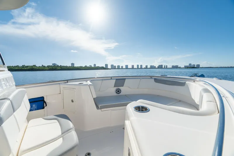 Hi Ho Silver Yacht Photos Pics 2022 Robalo R302 Center Console boat interior with waterfront city skyline view.