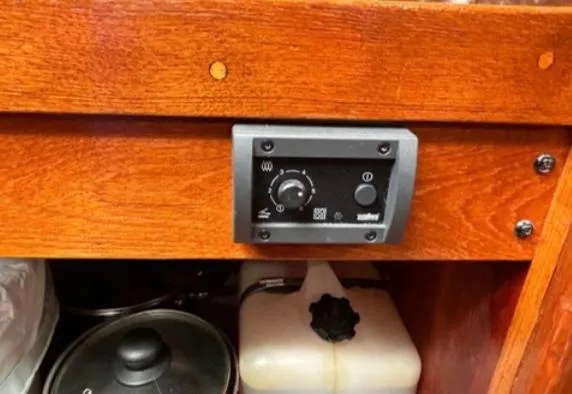 Control panel on 1982 Bristol Channel Cutter 28 with wooden cabinetry.