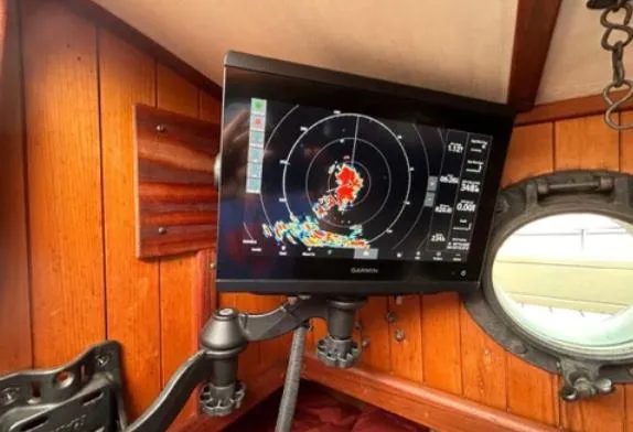 Garmin radar display inside 1982 Bristol Channel Cutter 28, mounted on wooden interior.
