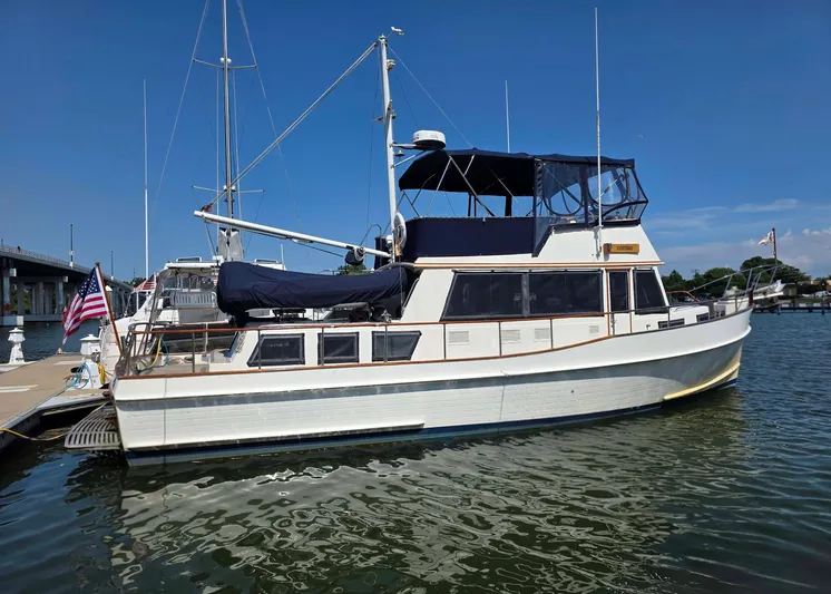 Kokomo Yacht Photos Pics 1993 Grand Banks 42 Classic yacht docked at marina under clear blue sky.