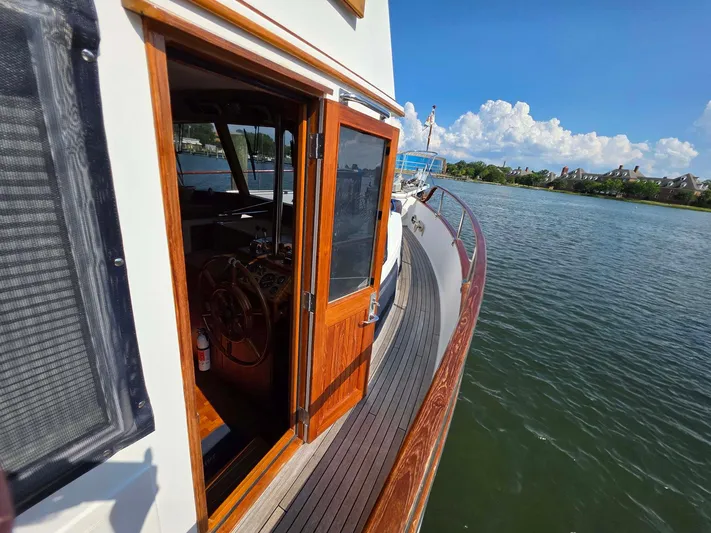 Kokomo Yacht Photos Pics Grand Banks 42 Classic yacht, 1993 model, with open cabin door on a sunny day.