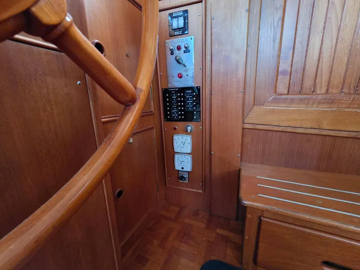 Kokomo Yacht Photos Pics Wooden helm and control panel inside 1993 Grand Banks 42 Classic yacht.