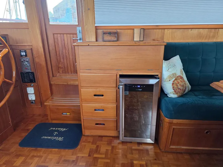 Kokomo Yacht Photos Pics Interior of 1993 Grand Banks 42 Classic yacht with wood cabinetry and seating area.