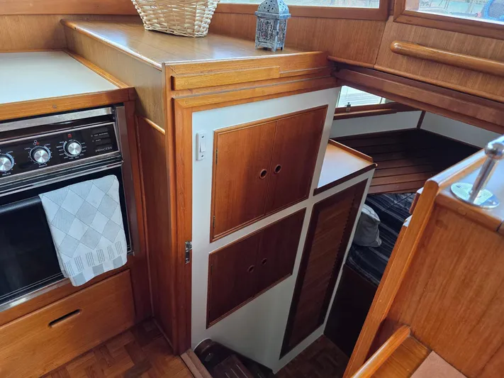 Kokomo Yacht Photos Pics Interior of 1993 Grand Banks 42 Classic yacht with wood cabinetry and oven.