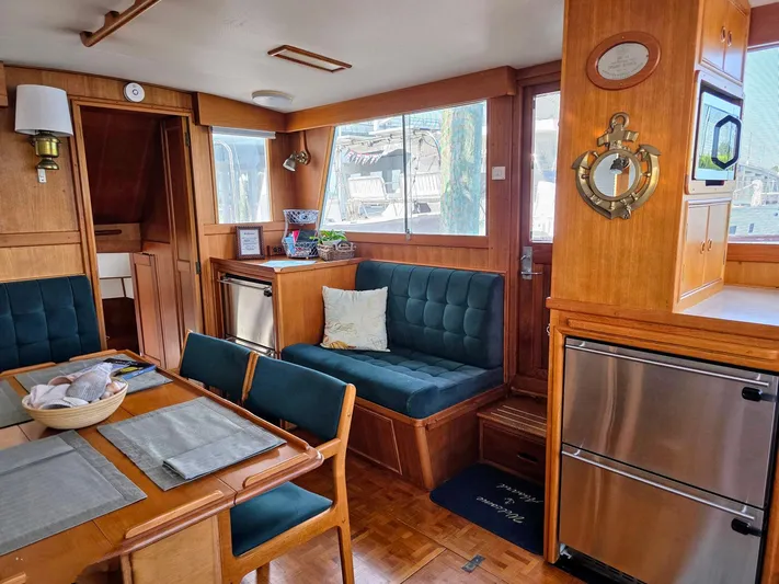 Kokomo Yacht Photos Pics Interior of 1993 Grand Banks 42 Classic yacht with wood finish and cozy seating area.