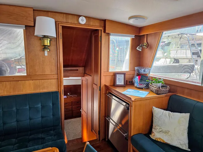 Kokomo Yacht Photos Pics Interior of 1993 Grand Banks 42 Classic yacht with wood paneling and cozy seating.
