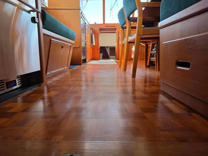 Kokomo Yacht Photos Pics Interior of 1993 Grand Banks 42 Classic yacht with wooden flooring and seating area.