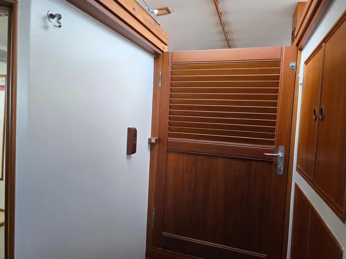 Kokomo Yacht Photos Pics Interior of 1993 Grand Banks 42 Classic yacht with wooden door and cabinets.