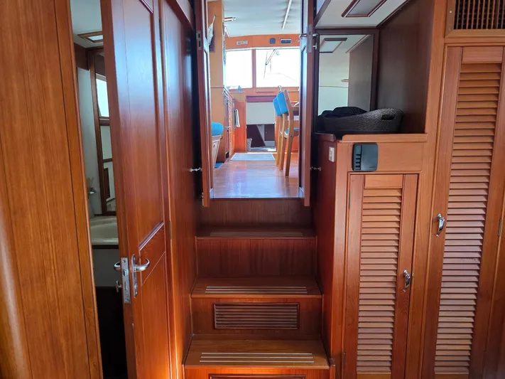Kokomo Yacht Photos Pics Interior of 1993 Grand Banks 42 Classic yacht with wooden cabinetry and stairs.