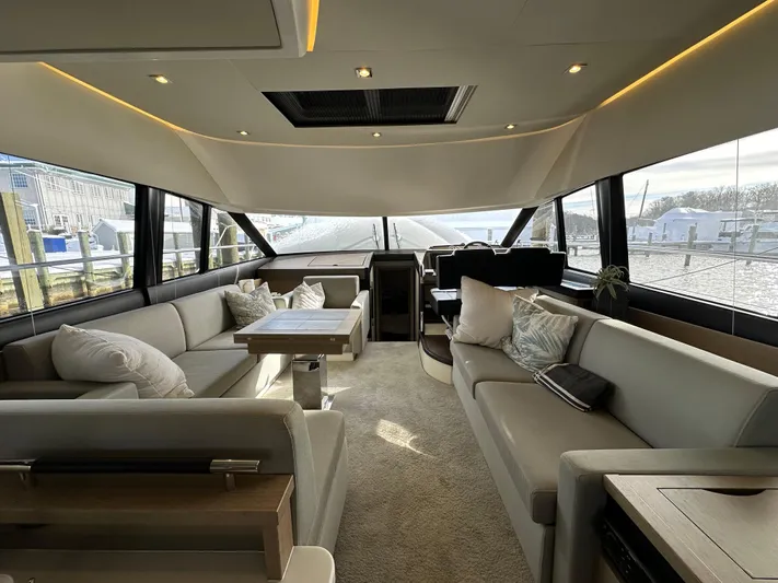  Yacht Photos Pics Luxurious interior of 2017 Prestige 500 yacht with elegant seating and panoramic windows.