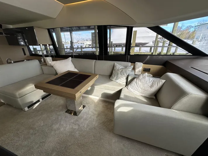  Yacht Photos Pics Luxurious interior of a 2017 Prestige 500 yacht with elegant seating and table.