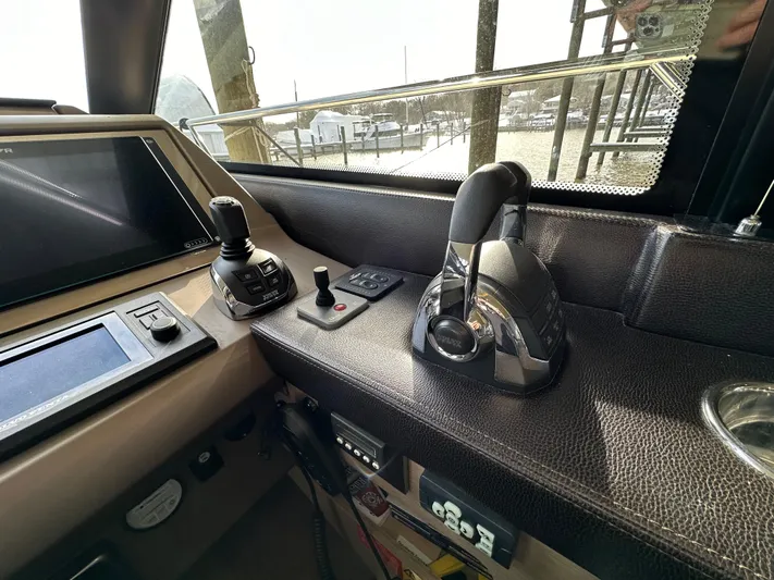  Yacht Photos Pics Control panel of a 2017 Prestige 500 yacht, featuring navigation and throttle controls.